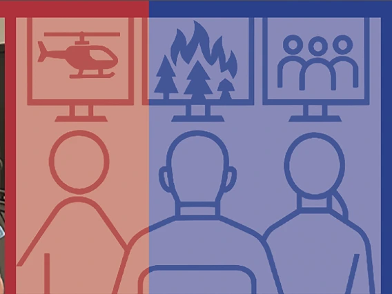 White haired man in front of maps