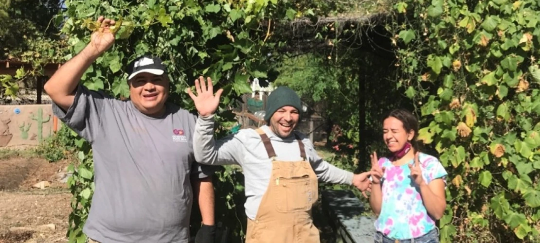 Community Food Bank staff members with Earth Grant student Madison Goforth