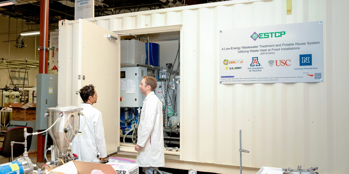 Two scientists talking at West Center
