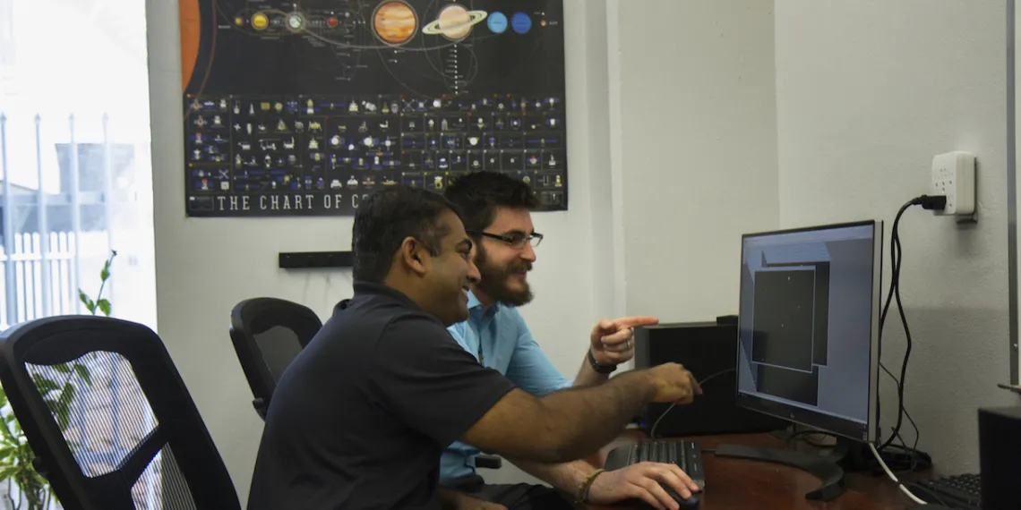Reddy and Campbell examine their animation of a Chinese space station flyby.