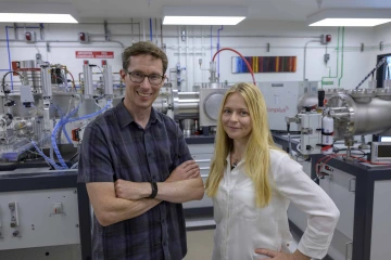 Researchers standing in a lab